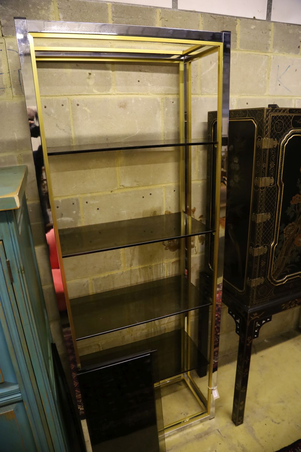 A pair of contemporary chrome and gilt shelving units, width 76cm, depth 38cm, height 202cm